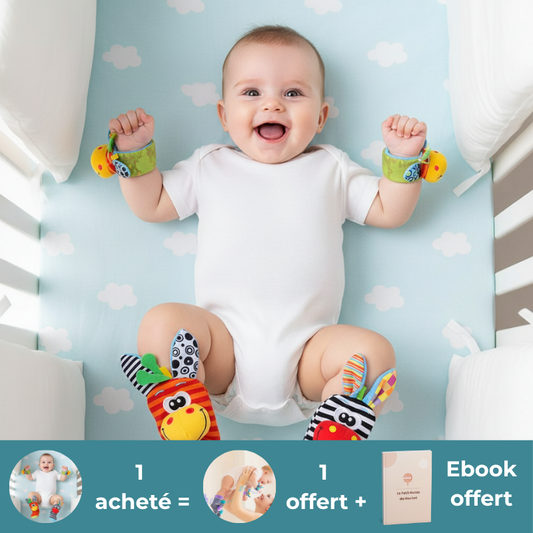 nourrisson joue hochet bébé rouge jaune lit barreau